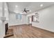 Comfortable living area boasting hardwood floors, a cozy fireplace, and ample natural light at 6615 E Phelps Rd, Scottsdale, AZ 85254