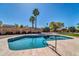 Stunning pool surrounded by lush greenery and palm trees for ultimate backyard enjoyment at 6615 E Phelps Rd, Scottsdale, AZ 85254