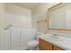 Bathroom features a walk-in tub, toilet, sink and mirror at 6711 W Osborn Rd # 82, Phoenix, AZ 85033