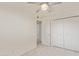 Bedroom with neutral walls, plush carpeting, large closet doors and lots of light at 6711 W Osborn Rd # 82, Phoenix, AZ 85033