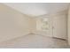 Inviting living room with neutral carpet, white walls, and lots of natural light at 6711 W Osborn Rd # 82, Phoenix, AZ 85033