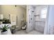 Modern bathroom featuring accessibility options, a pedestal sink, and tiled walk-in shower at 6722 E Jean Dr, Scottsdale, AZ 85254