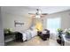 Comfortable bedroom with a single bed, ceiling fan, desk, chair, and ample natural light at 6722 E Jean Dr, Scottsdale, AZ 85254