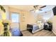 Cozy bedroom featuring wood-look floors, a ceiling fan, and a door to the outside at 6722 E Jean Dr, Scottsdale, AZ 85254