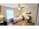 Cozy bedroom featuring neutral walls, single bed, large window, and decorative art at 6722 E Jean Dr, Scottsdale, AZ 85254