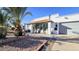 Charming single-story home with a landscaped yard, desert plants, and a covered front porch at 6722 E Jean Dr, Scottsdale, AZ 85254