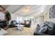 Bright living room with vaulted ceilings, tile floors, brick fireplace, and comfortable seating at 6722 E Jean Dr, Scottsdale, AZ 85254