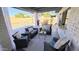 Comfortable covered patio featuring wicker seating, an area rug, and a view of the outdoor space at 6722 E Jean Dr, Scottsdale, AZ 85254