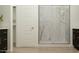 Contemporary bathroom featuring a frameless glass shower with marble-look tile at 7848 W Tether Trl, Peoria, AZ 85383