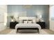 Beautifully staged main bedroom with light walls, carpet flooring, and a large bed with stylish pillows at 7848 W Tether Trl, Peoria, AZ 85383