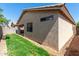 View of backyard featuring low maintenance landscaping, stucco walls and a covered patio at 857 E Impreria St, San Tan Valley, AZ 85140
