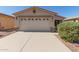 Charming single-story home featuring a large garage, desert landscaping, and a well-maintained front yard at 857 E Impreria St, San Tan Valley, AZ 85140