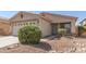 Charming home with desert landscaping, stone accents, and a well-manicured lawn at 857 E Impreria St, San Tan Valley, AZ 85140