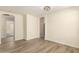 Open living room with wood-look flooring and views of the arched doorways at 857 E Impreria St, San Tan Valley, AZ 85140