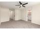 Spacious main bedroom with plush carpet and doorway leading to main bathroom at 857 E Impreria St, San Tan Valley, AZ 85140
