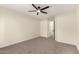 Large main bedroom with plush carpet and views of hallway with bedrooms at 857 E Impreria St, San Tan Valley, AZ 85140