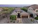 Beautiful aerial view of a residence with a well-manicured yard and desert landscaping in a scenic neighborhood at 9037 E Indigo St, Mesa, AZ 85207