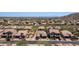 Expansive aerial view of a residential neighborhood, showcasing the community's layout and surrounding landscape at 9037 E Indigo St, Mesa, AZ 85207