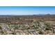 Aerial shot of a Primary-planned community, featuring pools, and recreational areas amidst desert landscaping at 9037 E Indigo St, Mesa, AZ 85207