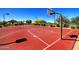 Well-maintained basketball court with colorful surfacing, providing a fun and active recreational space for residents at 9037 E Indigo St, Mesa, AZ 85207