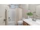 Bright bathroom featuring a shower-tub combo, vanity, toilet, and modern fixtures at 9037 E Indigo St, Mesa, AZ 85207