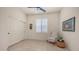 Bedroom featuring a closet, window with plantation shutters, chair, and tile flooring at 9037 E Indigo St, Mesa, AZ 85207