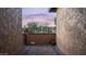 View of a private courtyard with brick pavers and desert landscaping, framed by stucco walls at 9037 E Indigo St, Mesa, AZ 85207