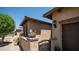 Home exterior highlighting stucco walls, a brick-lined gate and desert landscaping at 9037 E Indigo St, Mesa, AZ 85207
