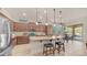 Gourmet kitchen with stainless steel appliances, granite countertops, and a breakfast bar at 9037 E Indigo St, Mesa, AZ 85207