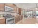 Modern kitchen featuring stainless steel appliances and granite countertops at 9037 E Indigo St, Mesa, AZ 85207