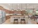 Spacious kitchen with granite counters, stainless steel appliances, and large island with bar stool seating at 9037 E Indigo St, Mesa, AZ 85207