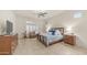 Comfortable main bedroom with a ceiling fan, a sitting area and abundant natural light at 9037 E Indigo St, Mesa, AZ 85207