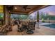 Covered patio with seating, grill, and hot tub provides an ideal space for outdoor living at 9037 E Indigo St, Mesa, AZ 85207