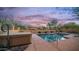 Sparkling pool and hot tub with desert landscaping offers a serene and private backyard retreat at 9037 E Indigo St, Mesa, AZ 85207