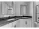 Modern bathroom featuring double sinks, dark countertops, and sleek fixtures at Xxxx S Hunt Hwy, Queen Creek, AZ 85142