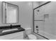 Modern bathroom showcasing a sleek glass shower, toilet, and vanity with a black countertop at Xxxx S Hunt Hwy, Queen Creek, AZ 85142