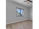Bedroom with neutral color palette, wood-look floors and bright natural light from window at Xxxx S Hunt Hwy, Queen Creek, AZ 85142