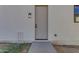 Side entrance featuring a modern exterior light fixture and sleek door design at Xxxx S Hunt Hwy, Queen Creek, AZ 85142