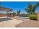 Backyard featuring a pool, gazebo, gravel, patio and privacy wall for outdoor living at 11020 N 154Th Ln, Surprise, AZ 85379