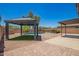 Backyard boasts a gazebo, pool, rock landscaping and concrete patio, ideal for relaxation at 11020 N 154Th Ln, Surprise, AZ 85379