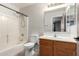 Bathroom showcasing a single sink vanity, mirror, and tub with showerhead at 11020 N 154Th Ln, Surprise, AZ 85379