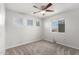 Neutrally decorated bedroom features carpeted floors and natural light from windows at 11020 N 154Th Ln, Surprise, AZ 85379