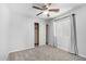 Neutral bedroom featuring a ceiling fan, carpet, and closet space with sliding doors at 11020 N 154Th Ln, Surprise, AZ 85379