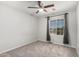 Neutral bedroom featuring a ceiling fan, carpet, and a window at 11020 N 154Th Ln, Surprise, AZ 85379