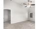 Bright, carpeted bedroom offers a ceiling fan and a window with natural light at 11020 N 154Th Ln, Surprise, AZ 85379