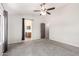 Carpeted bedroom features a ceiling fan, and access to the bathroom at 11020 N 154Th Ln, Surprise, AZ 85379