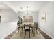 Staged dining room with wood floors, light walls, and dining room set at 11020 N 154Th Ln, Surprise, AZ 85379