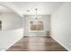 Bright dining room with hardwood floors and a large window at 11020 N 154Th Ln, Surprise, AZ 85379