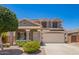 Charming two-story home with a well-manicured front yard and a two-car garage at 11020 N 154Th Ln, Surprise, AZ 85379