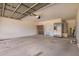 Spacious garage featuring concrete floors, a water heater, and ample storage space at 11020 N 154Th Ln, Surprise, AZ 85379